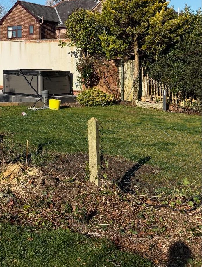 The border cleared, the houses behind now in view